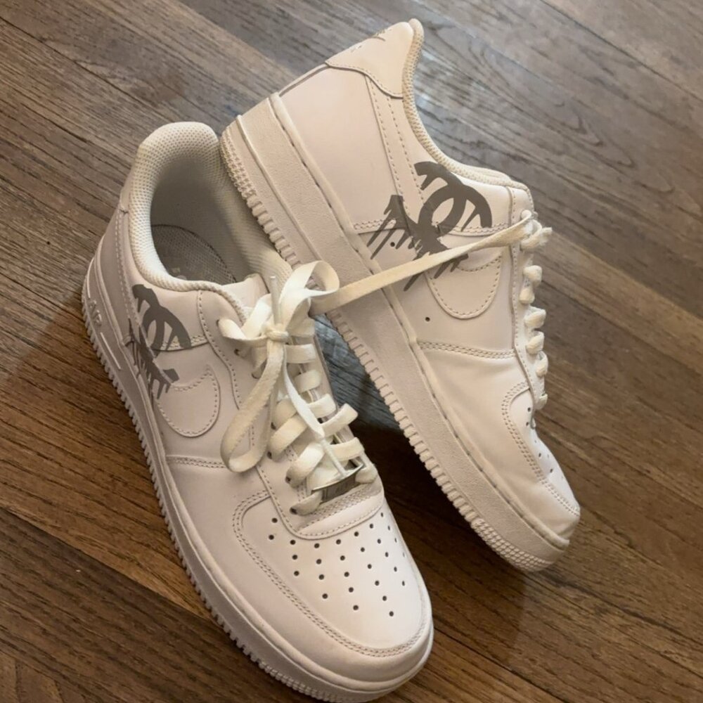 Womens size 9 Nike Air Force ones with customized metallic Chanel symbol.